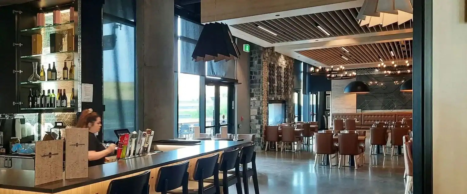 Commercial Restaurant Bar Interior Painting A modern commercial restaurant or bar interior with stylish lighting and a well stocked bar.