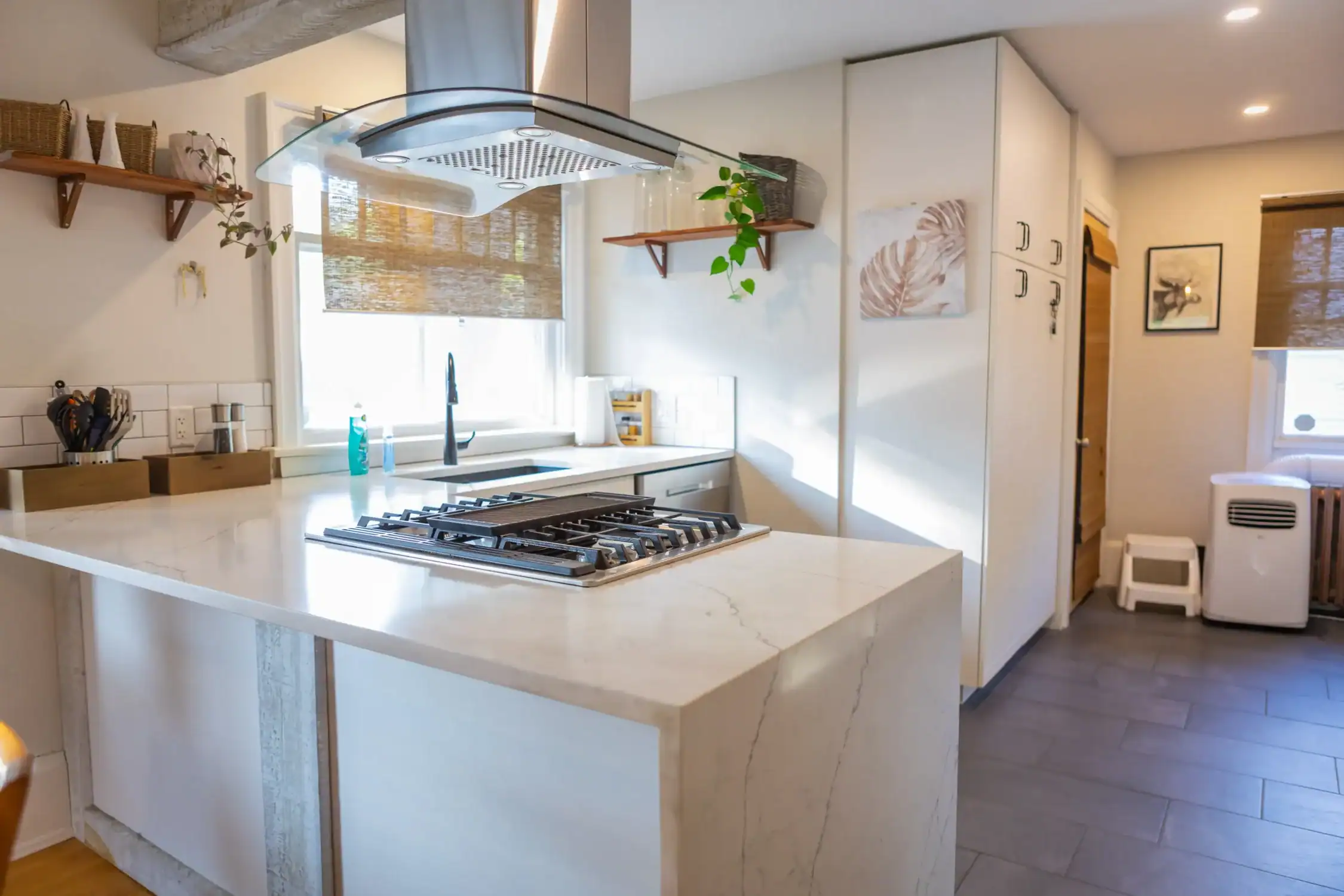 Modern Kitchen Interior Painting Services A bright, modern kitchen with freshly painted white walls and cabinets, showcasing professional interior painting.