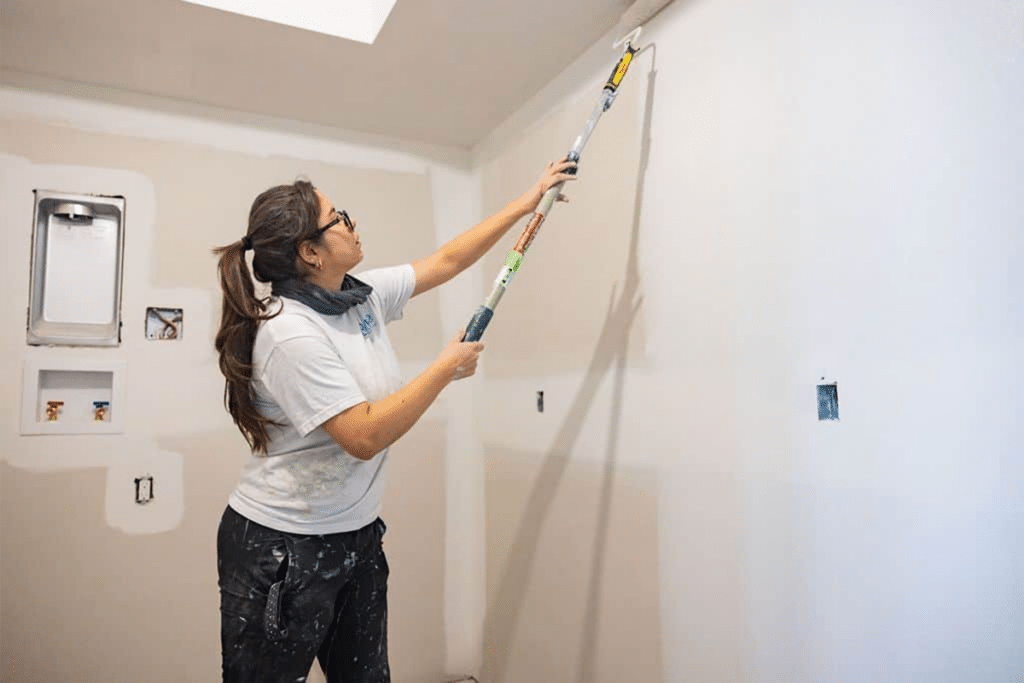 interior painters Professional painter working on an interior wall in a Saskatoon home